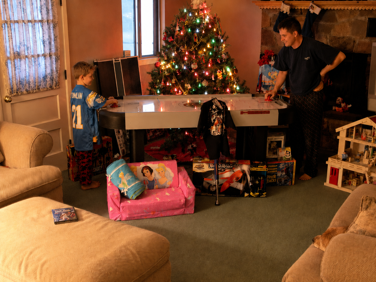 Family enjoying time together beside a decorated Christmas tree